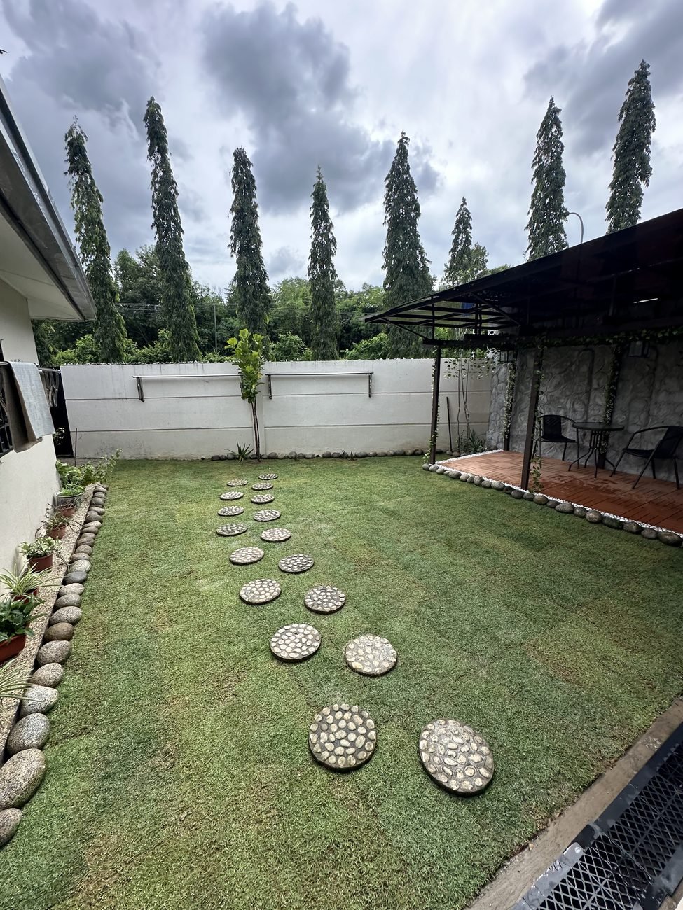 Backyard lawn with stepping stone path, Papar